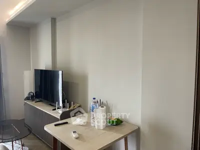 Modern living room with sleek TV stand and minimalist decor, perfect for contemporary living.