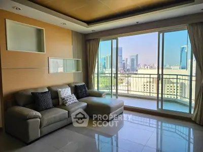 Spacious living room with city view and large balcony in modern apartment