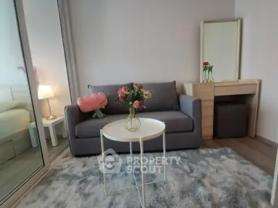 Cozy living room with modern sofa and stylish decor in a chic apartment.