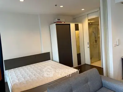 Modern bedroom with ensuite bathroom and sleek furniture design