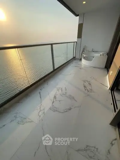 Luxurious balcony with stunning ocean view and elegant marble flooring