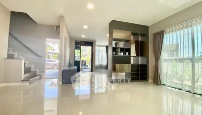 Spacious modern living room with large windows and sleek design