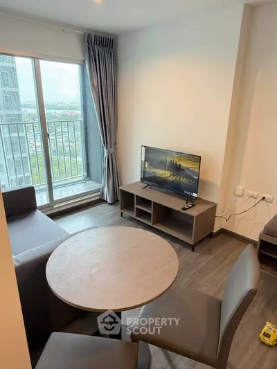 Modern living room with balcony view in high-rise apartment