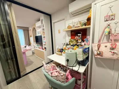 Charming compact living space with modern decor and efficient storage solutions.