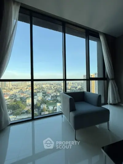 Stunning high-rise apartment with panoramic city view and modern interior design.