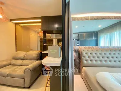 Modern apartment interior with cozy living room and elegant bedroom, featuring stylish lighting and decor.