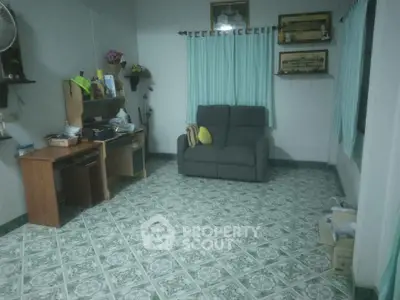 Cozy living room with tiled floor and comfortable seating