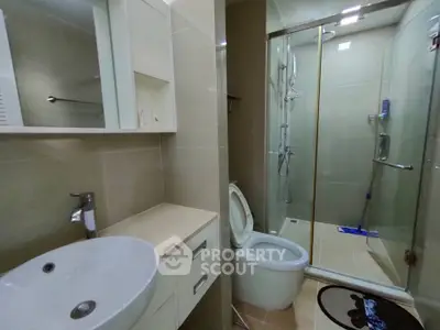 Modern bathroom with glass shower and sleek fixtures