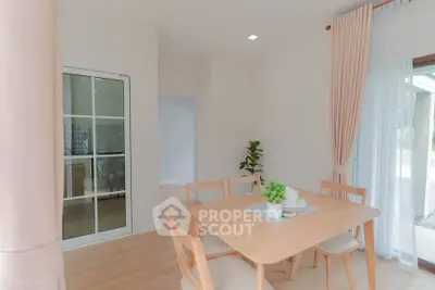 Bright dining area with wooden furniture and large windows in modern home