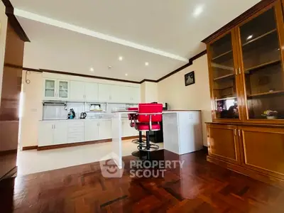 Spacious kitchen with modern design and wooden flooring