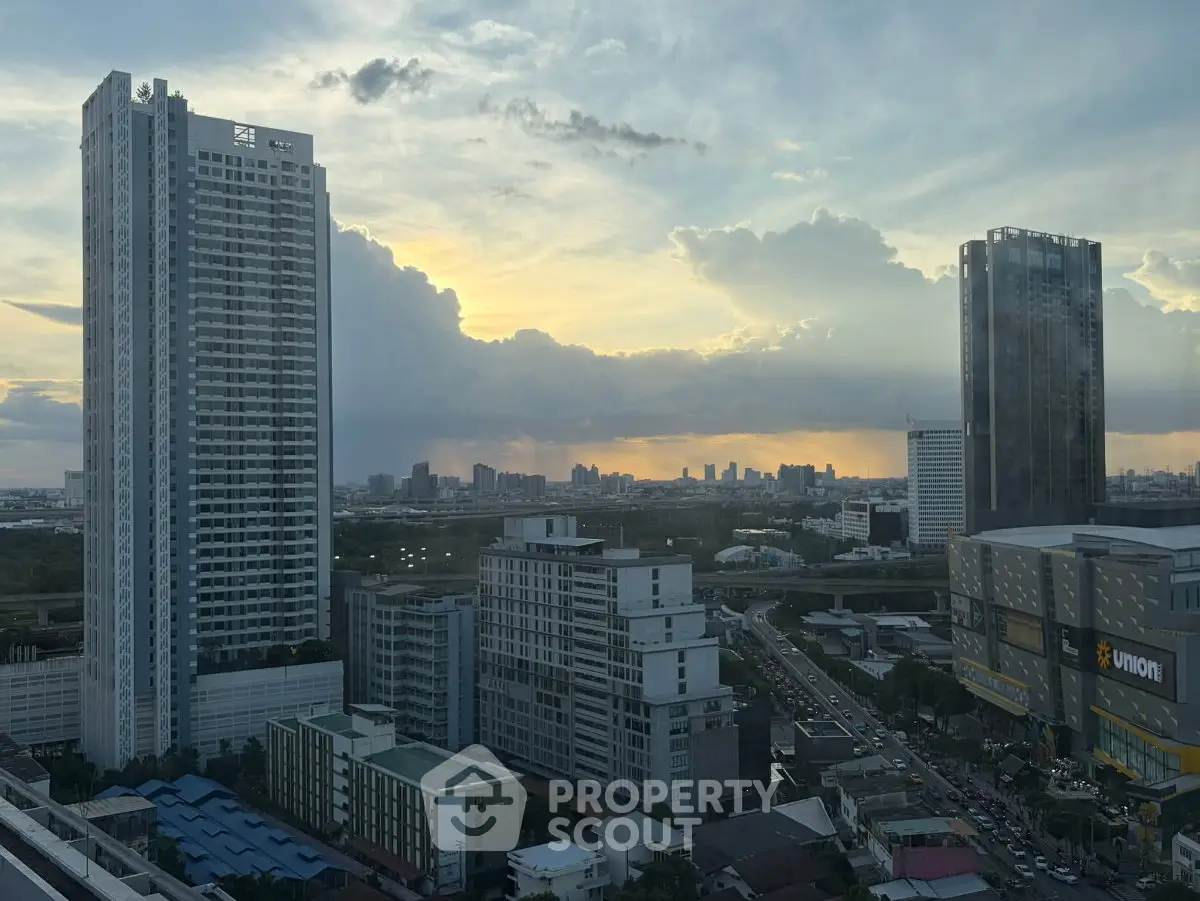 Stunning cityscape view with modern high-rise buildings at sunset, perfect for urban living enthusiasts.