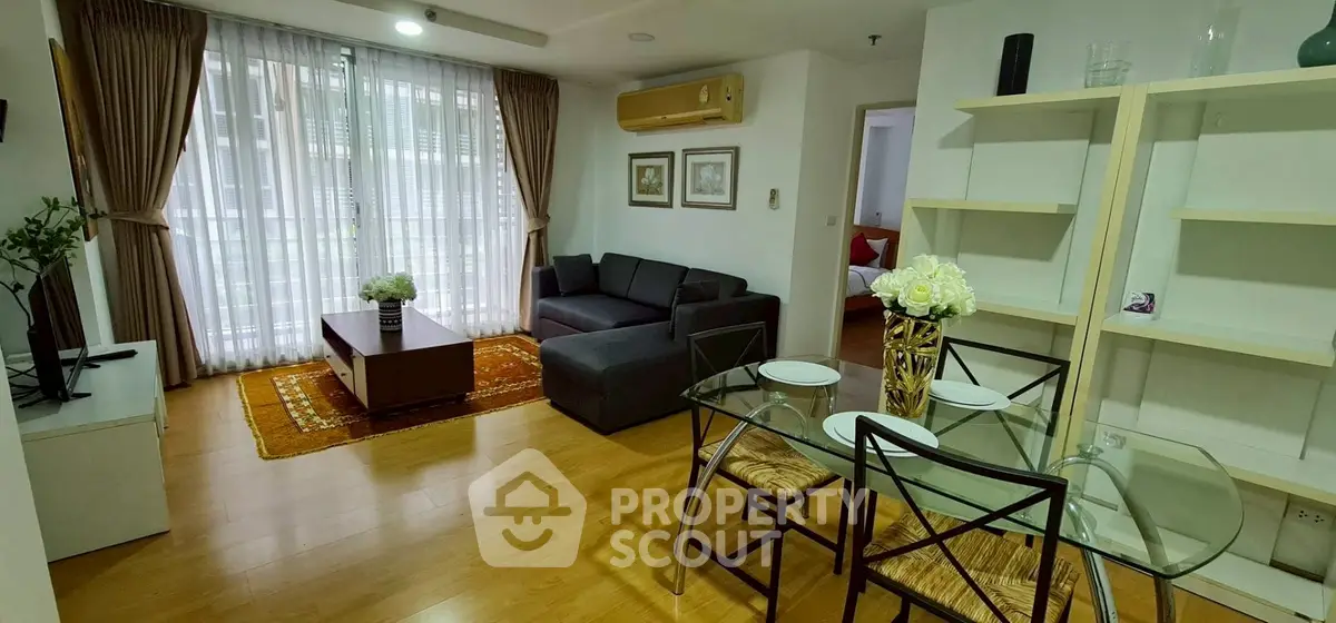 Charming living room with modern decor and natural light in cozy apartment.