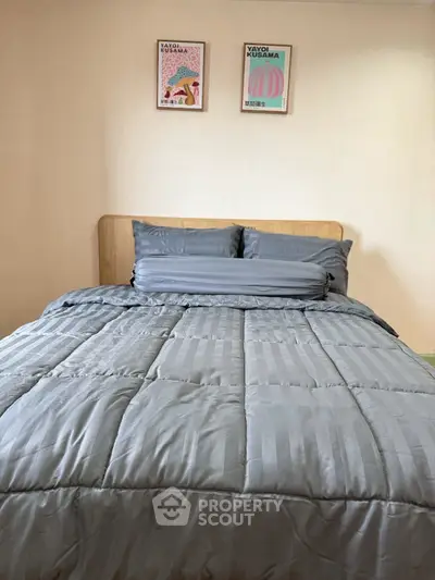 Cozy bedroom with modern decor and plush bedding
