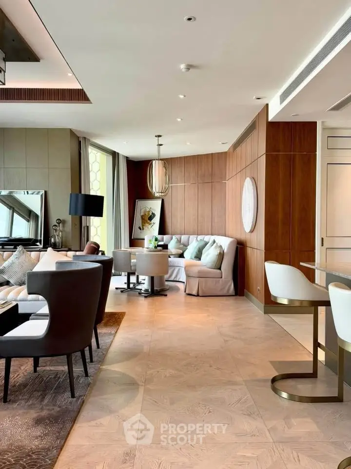 Luxurious open-plan living room with elegant decor and modern furnishings in a high-end apartment.