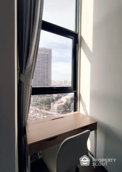 Bright study nook with city view, perfect for work-from-home setup.