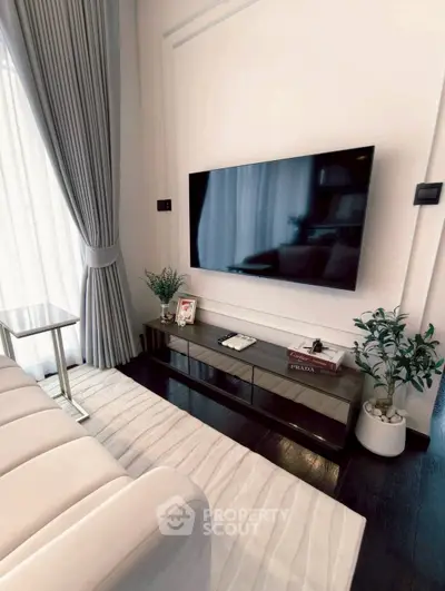 Elegant living room with modern TV setup and stylish decor