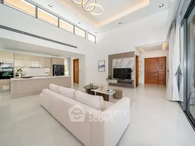 Luxurious open-plan living room with modern kitchen and elegant decor