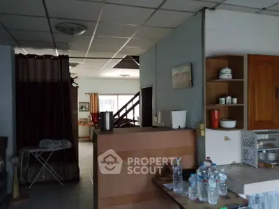 Spacious kitchen with open layout and dining area in a cozy home.