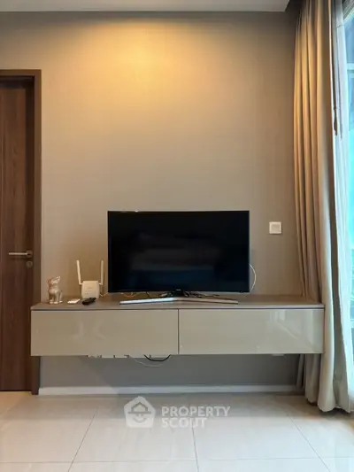 Modern living room with sleek TV unit and elegant decor