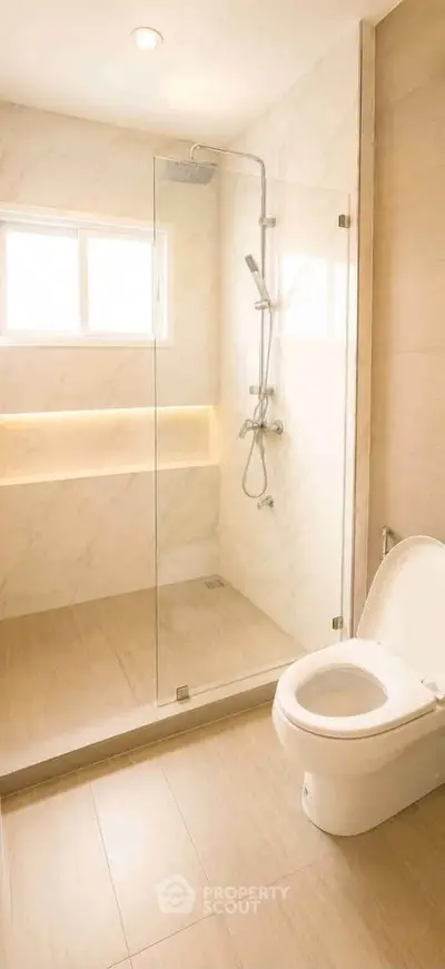 Modern bathroom with glass shower and elegant fixtures