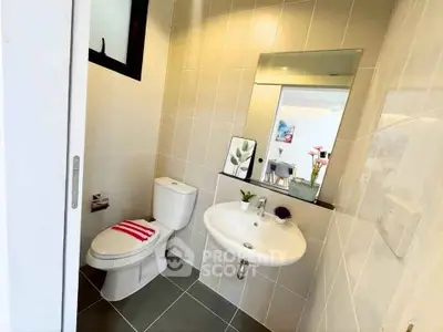 Modern bathroom with sleek fixtures and stylish decor in a contemporary home.