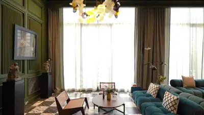 Luxurious living room with elegant decor and large windows