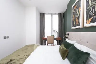 Modern bedroom with stylish decor and natural light