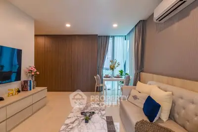 Modern living room with elegant decor and dining area, featuring a marble coffee table and stylish furnishings.