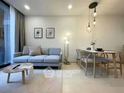 Modern living room with stylish furniture and elegant lighting, perfect for cozy gatherings.