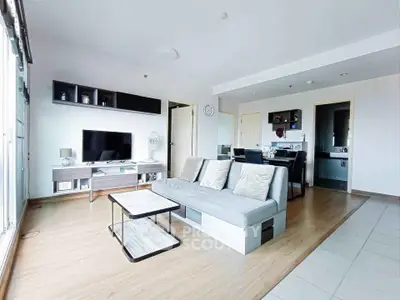 Spacious modern living room with sleek furniture and open layout