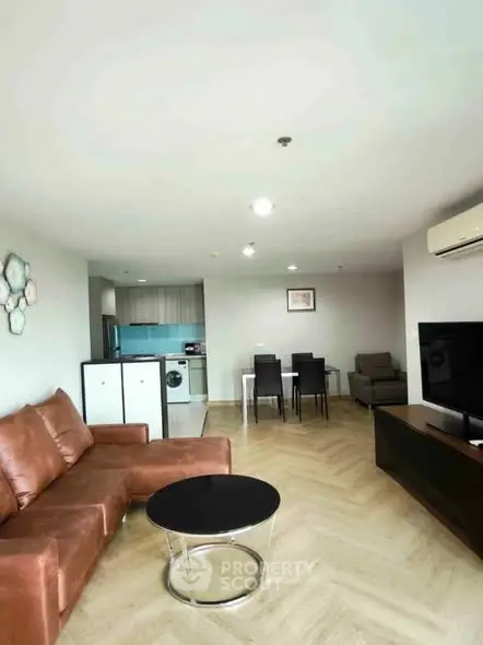 Spacious modern living room with open layout and stylish furniture in a contemporary apartment.