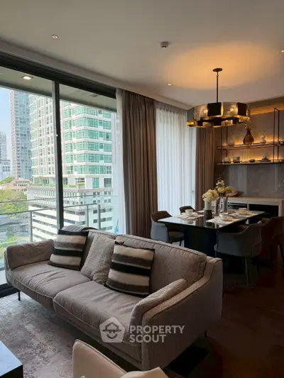 Luxurious living room with elegant dining area and city view, perfect for modern urban living.