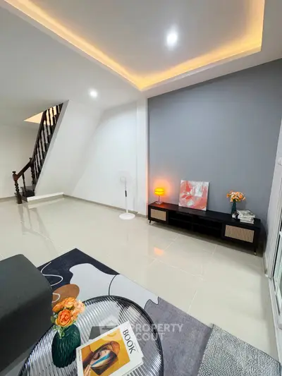 Modern living room with stylish decor and ambient lighting