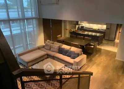 Luxurious open-plan living room with modern kitchen and stylish decor