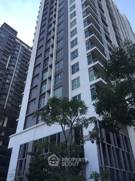 Modern high-rise building with sleek design and large windows