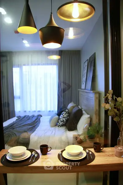Modern bedroom with stylish lighting and cozy decor, perfect for relaxation and comfort.