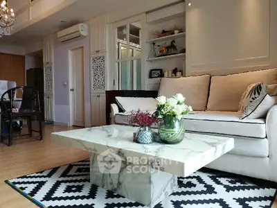Elegant living room with marble coffee table and stylish decor