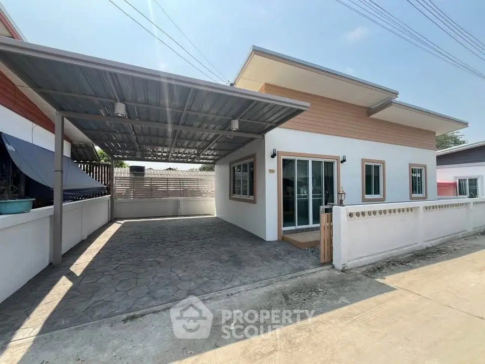 Modern single-story house with carport and stylish facade