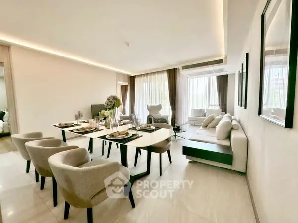 Luxurious modern living room with elegant dining area and natural light.