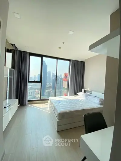 Modern bedroom with city view and natural light in high-rise apartment