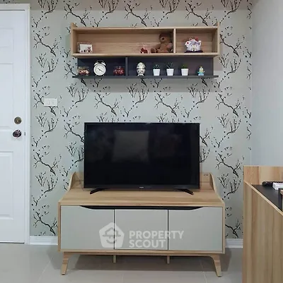 Modern living room with stylish TV stand and decorative wall shelves