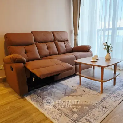 Cozy living room with plush brown sofa and elegant coffee table near large window