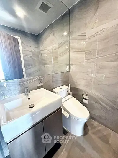 Modern bathroom with sleek fixtures and elegant tile design