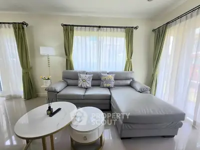 Elegant living room with modern gray sectional sofa and stylish decor