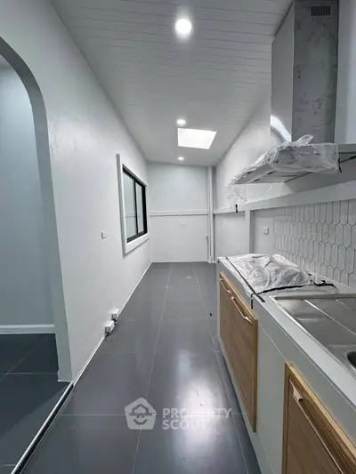 Modern kitchen with sleek design and ample natural light