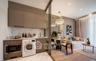Modern open-plan kitchen and living room with stylish decor and appliances.