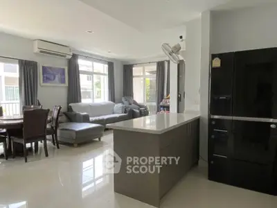 Spacious modern living room with open kitchen and elegant dining area