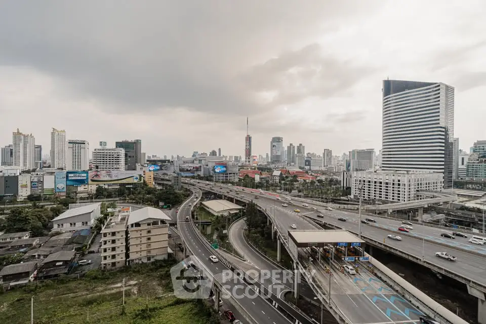 Stunning cityscape view showcasing modern skyscrapers and bustling highways, perfect for urban living enthusiasts.