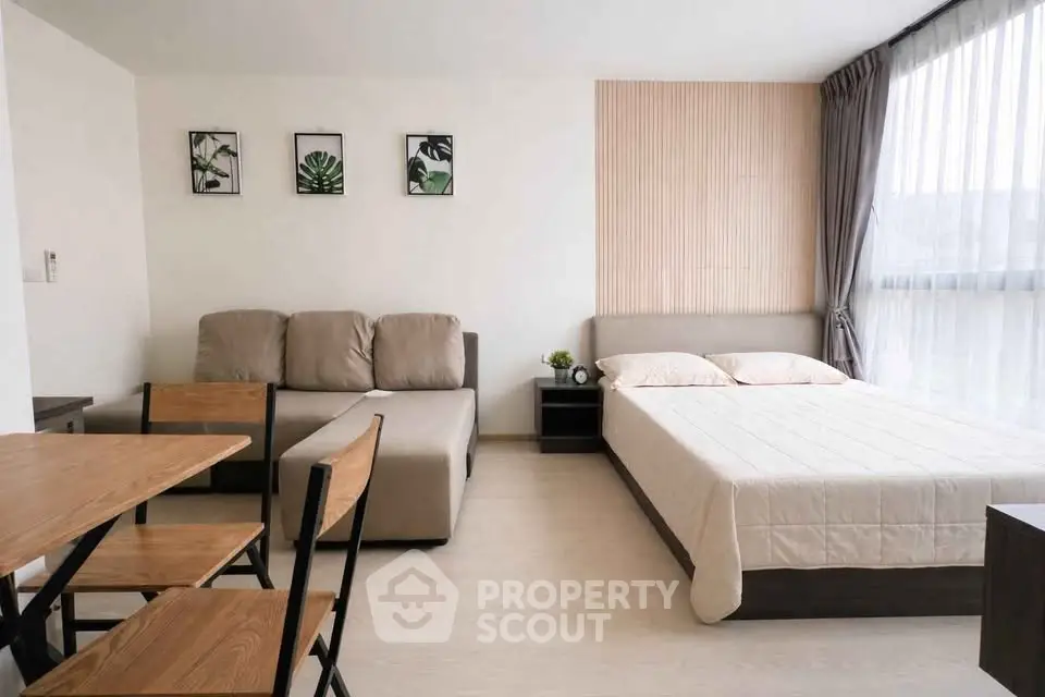 Modern studio apartment with cozy living area and stylish decor