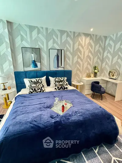 Luxurious bedroom with modern decor and stylish blue accents